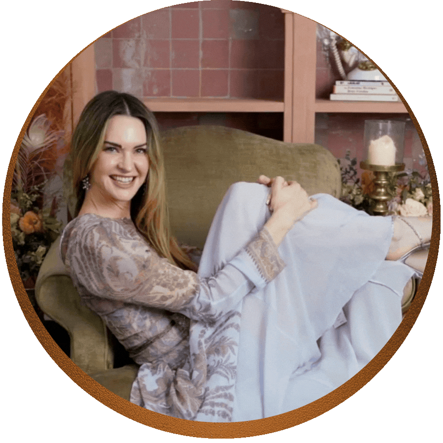 Layla Martin smiling warmly and throwing up her hands