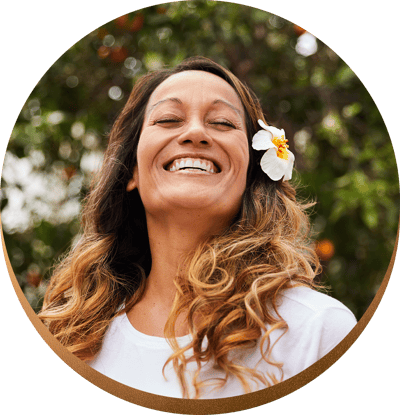 Woman with a big smile radiating feminine energy